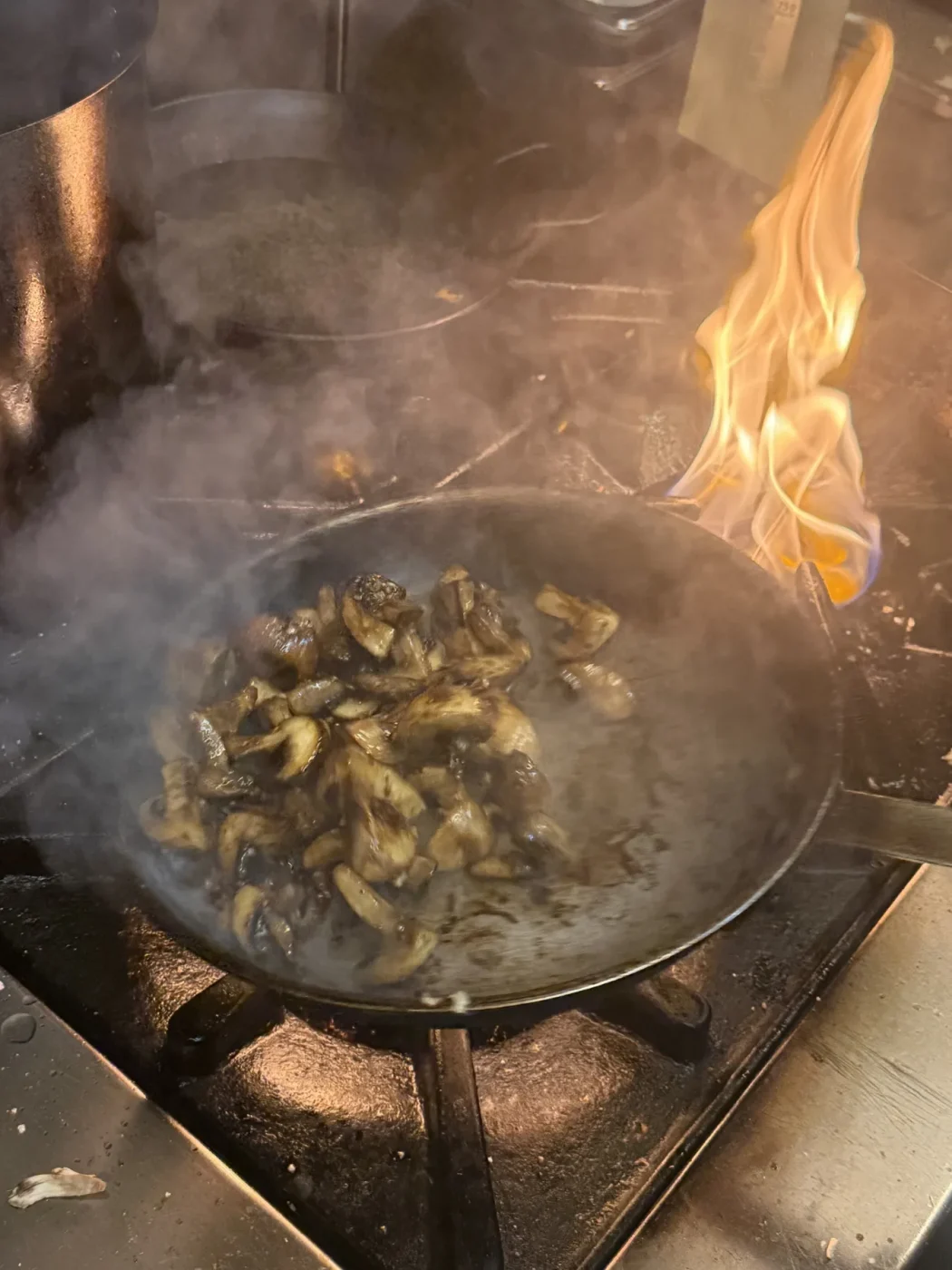 A dish cooking over flame in the Duende kitchen